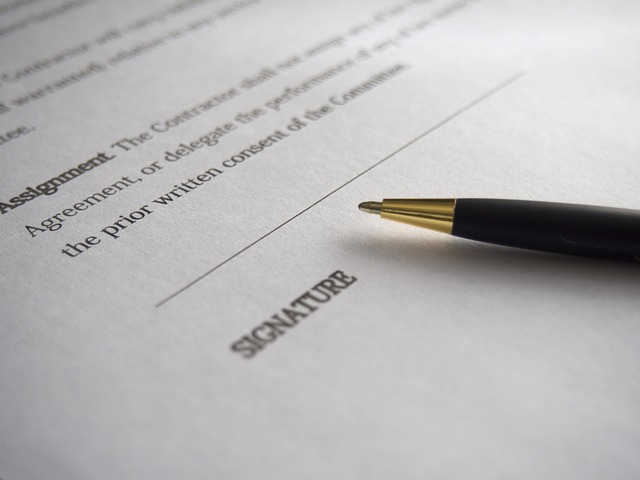 Lease - close-up of a pen resting on a contract near the signature line