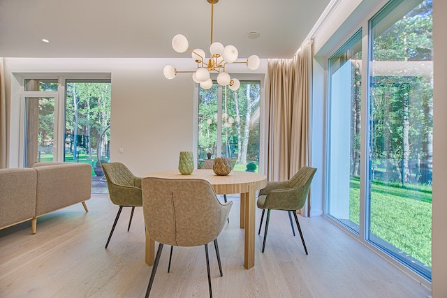 a large open floor plan dining room with four chairs and a round table