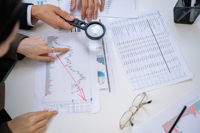people analyzing market trends