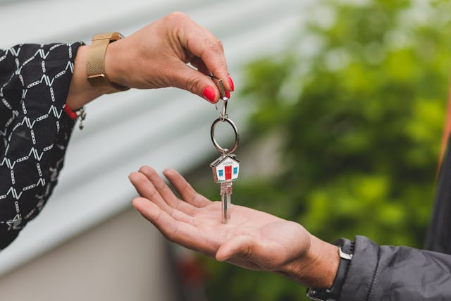 someone handing over house keys